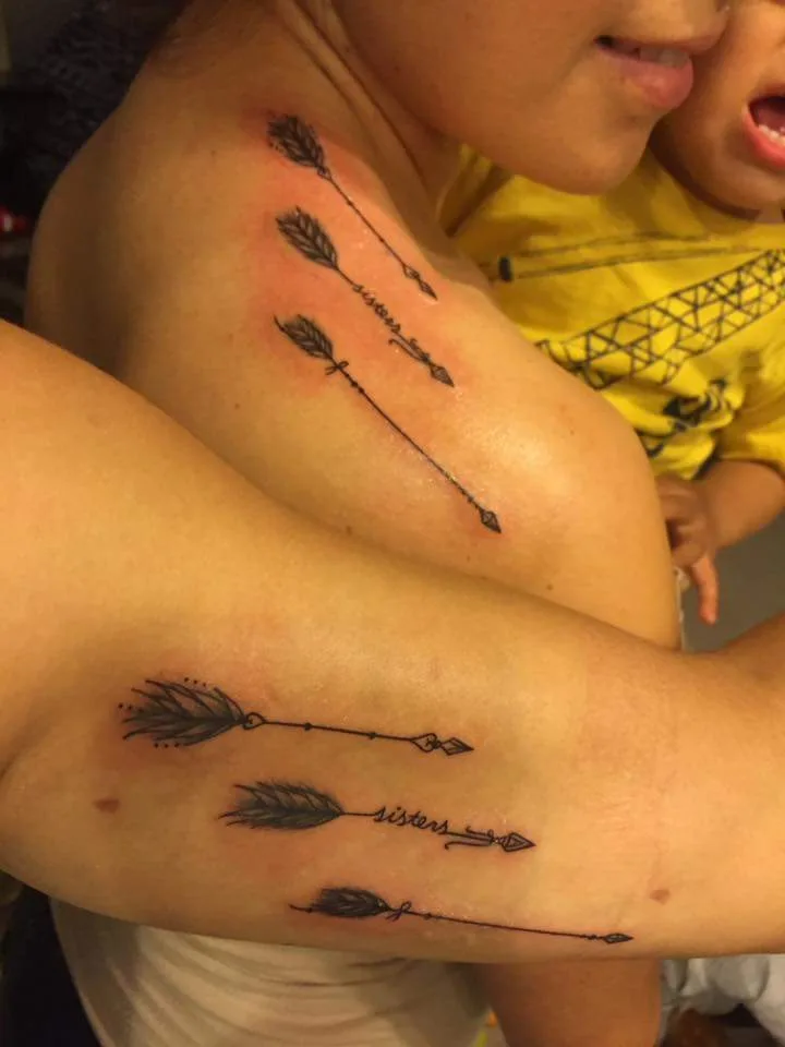 Designer Feather Arrow Matching Sister Tattoo On Shoulder And Upper Arms