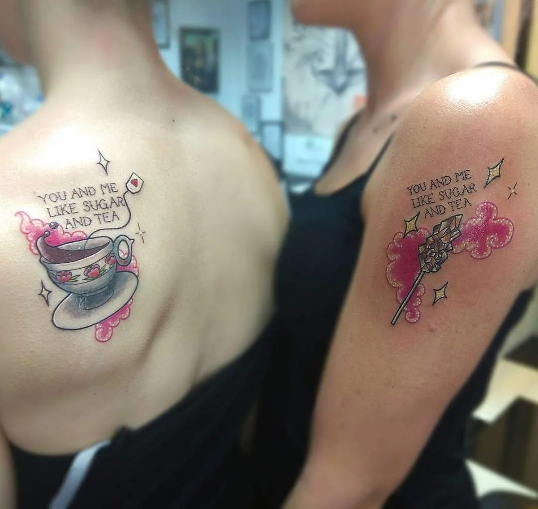 Funky Image And Quote Matching Tattoo On Upper Back And Upper Arm