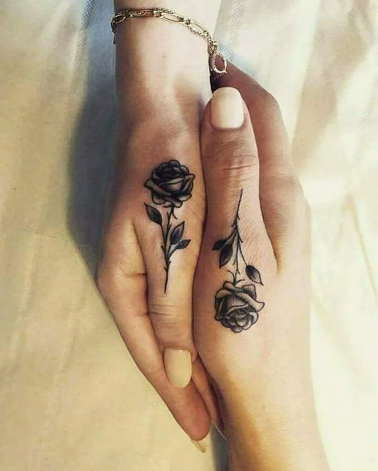 Gorgeous Black And White Rose Tattoo On Thumb