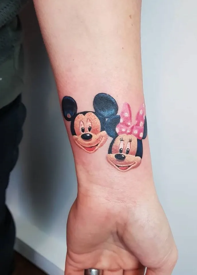 Realistic Mickey And Minnie Mouse Inked On Wrist
