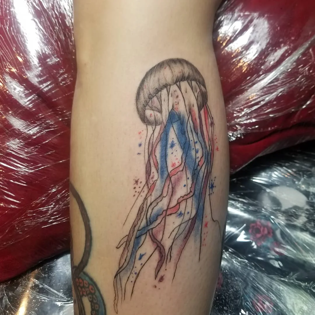 Jelly fish Watercolor Tattoo designs for women on inner arm.