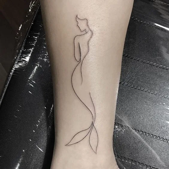 Trendy Lower Leg Tattoo.