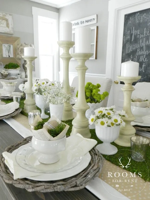 Vintage-inspired place settings to the daisies and white candlesticks.