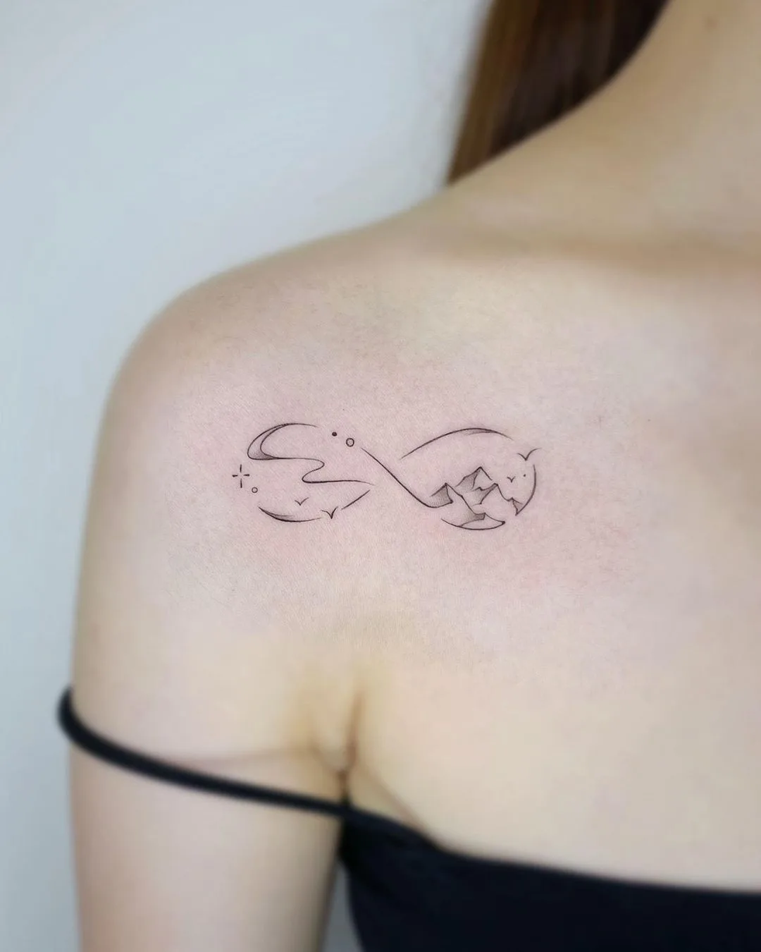 Minimalist Mountain Infinity Tattoo on Shoulder
