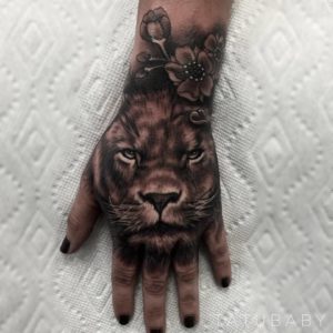 Lion With Flowers Tattoo on Hand