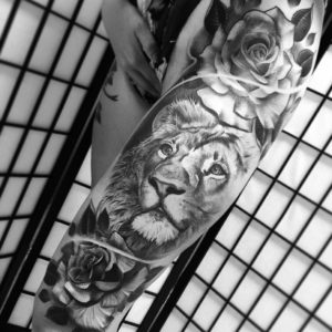 Realistic Black And grey Lion Tattoo On Thigh