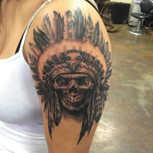 Skull With Feather On The Shoulder