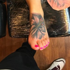 Relastic Lily Flower Tattoo On Foot