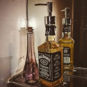 Empty Whiskey Bottle Used As Hand Wash