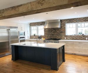 Brick Backsplash With Organic White Quartz Countertop