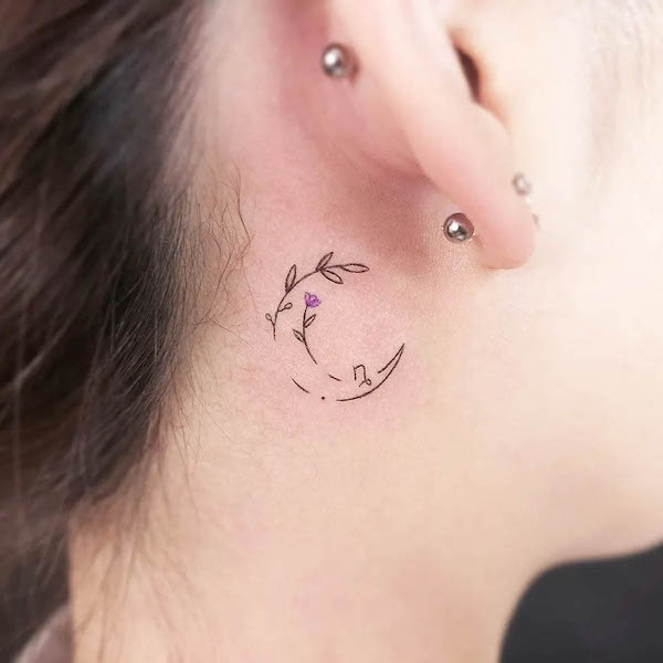 Minimalist Crescent Moon Behind the Ear Tattoo