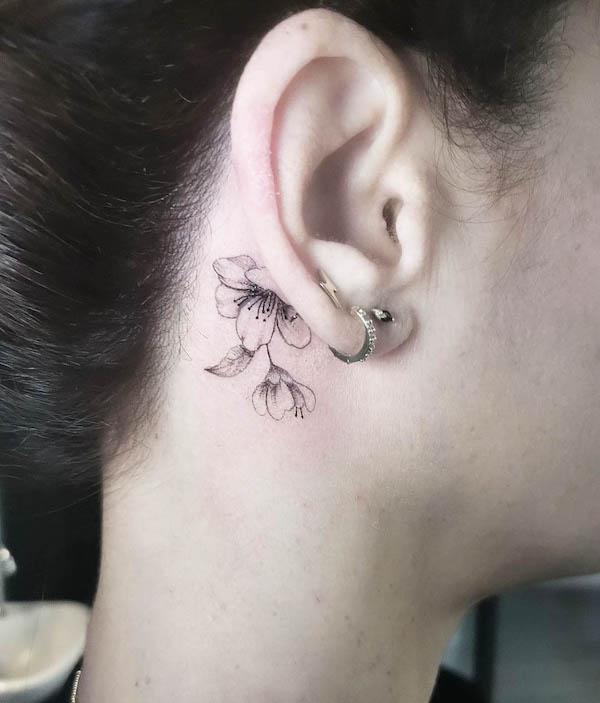 Elegant Floral Tattoo Behind the Ear