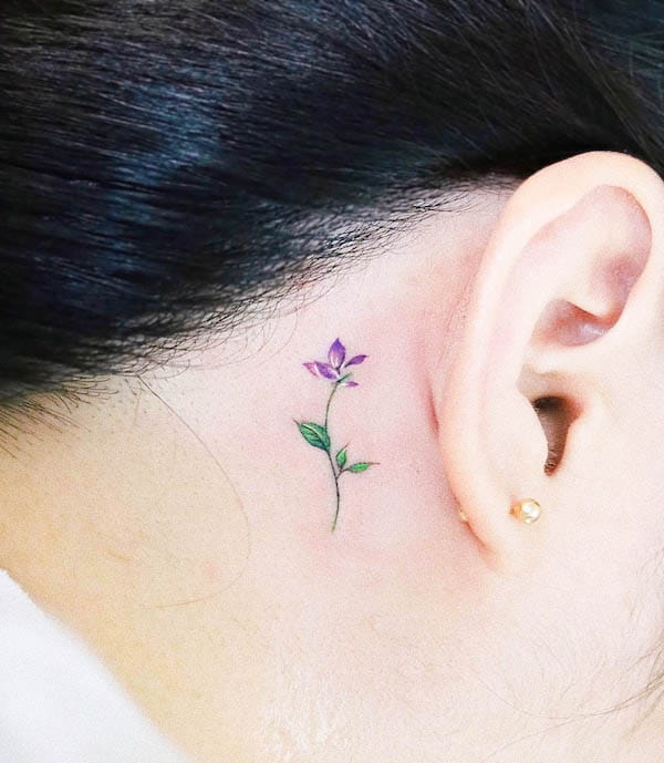 Delicate Violet Flower Behind-the-Ear Tattoo