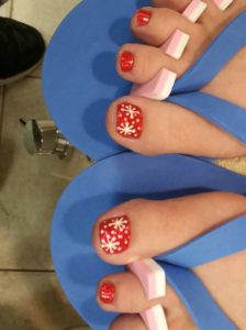 Pretty red toes with snowflakes. Pic by perfect_nails_and_spa_