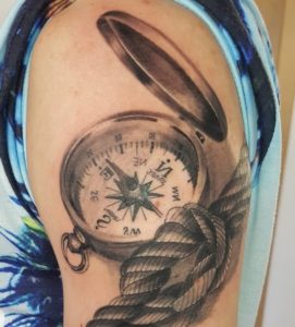 Eye-popping 3D compass tattoo on half sleeve.