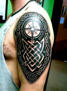 Star tribal tattoo designs on arm and shoulder.