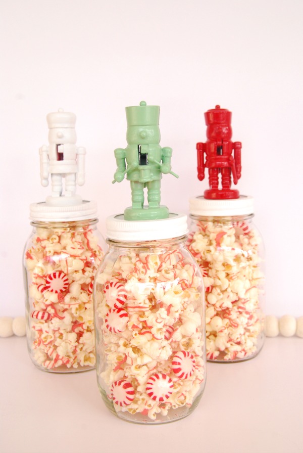 Candy filled mason jar with nutcracker topper.