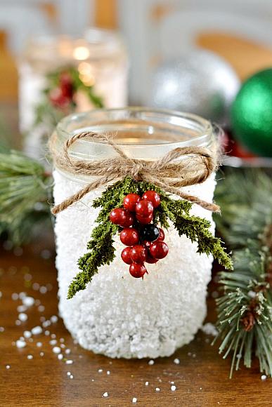 Snowy mason jar tied with berries and twin.