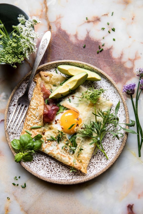 Baked egg crepes with spring herbs and avocado.