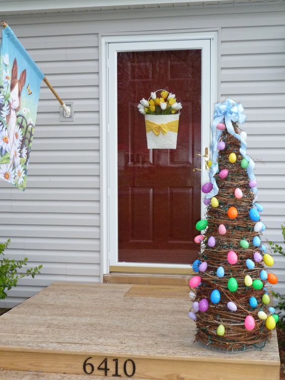 Grapevine tree decorated with colorful plastic Easter eggs.