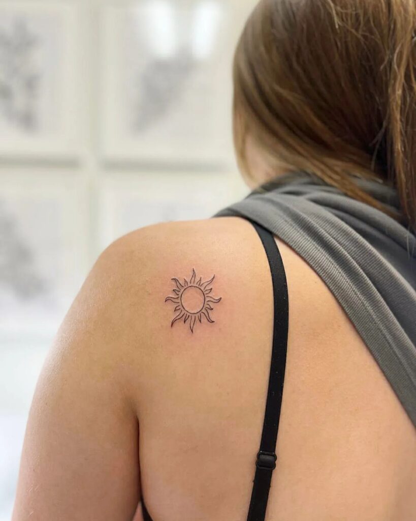 Detailed Sun Tattoo on Shoulder Blade