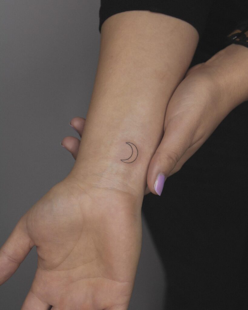 Feminine Moon Outline Tattoo