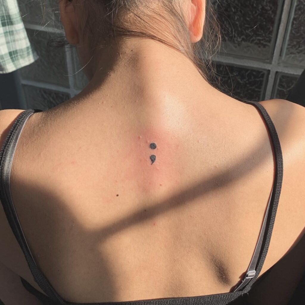 Back Side Semicolon Tattoo