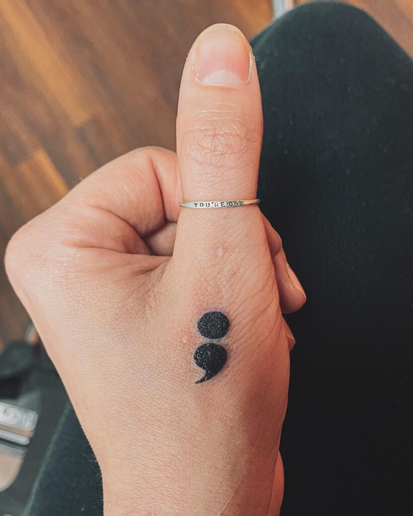 Bold Thumb Semicolon Tattoo