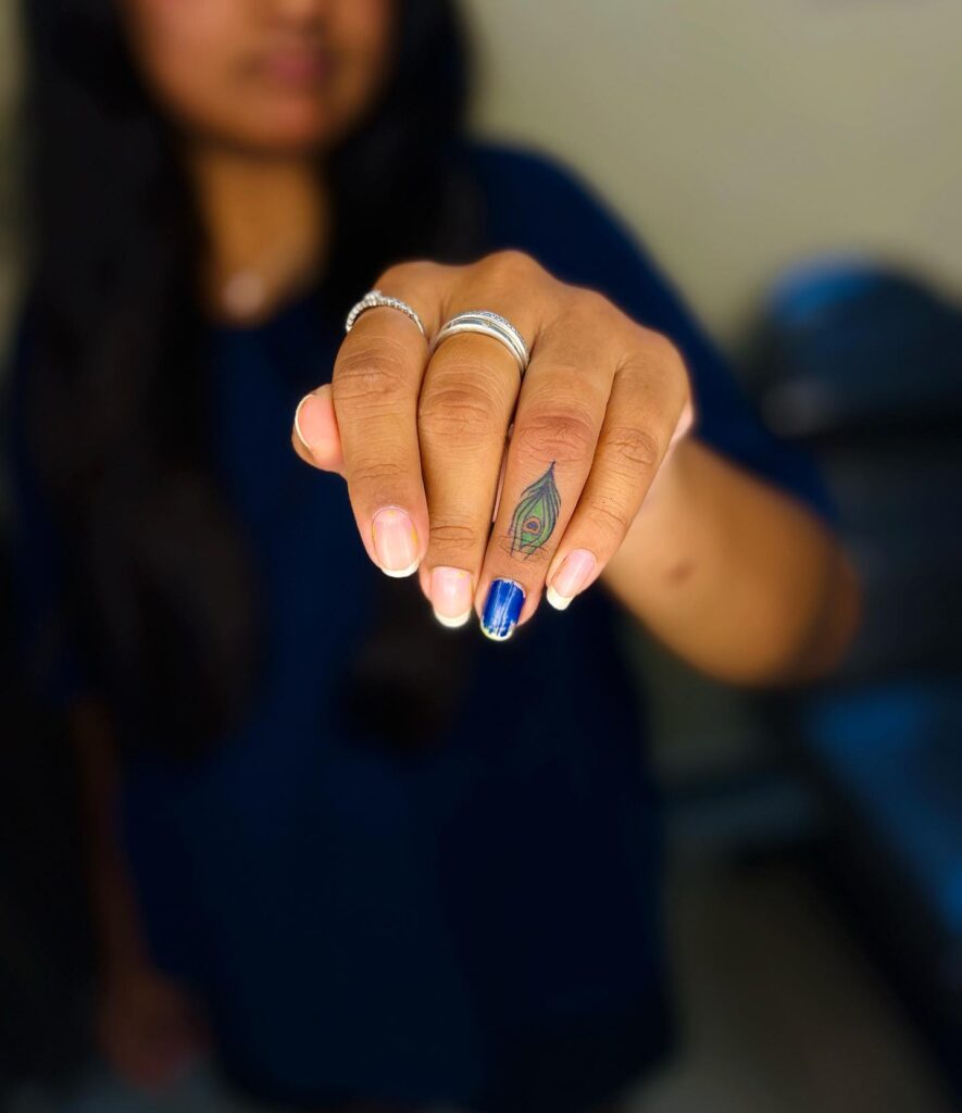 Feather Small Finger Tattoo on Outer Ring