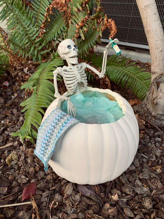 Pumpkin hot tub with a skeleton