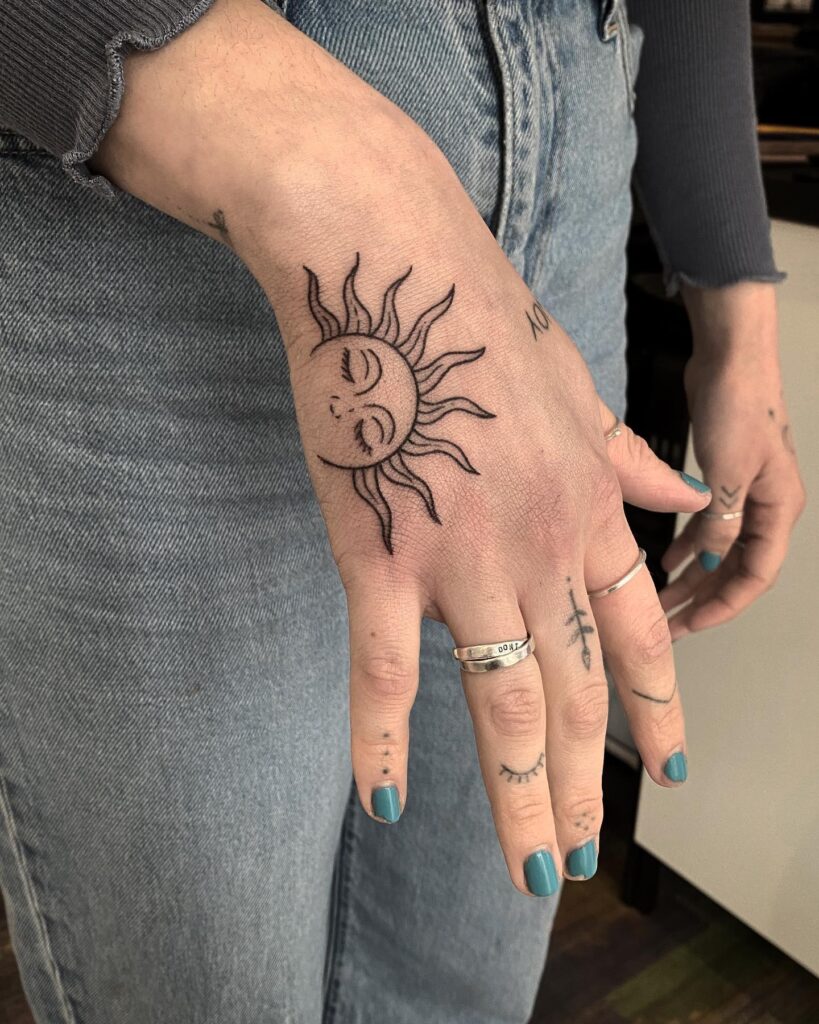 Sleepy Sun Hand Tattoo